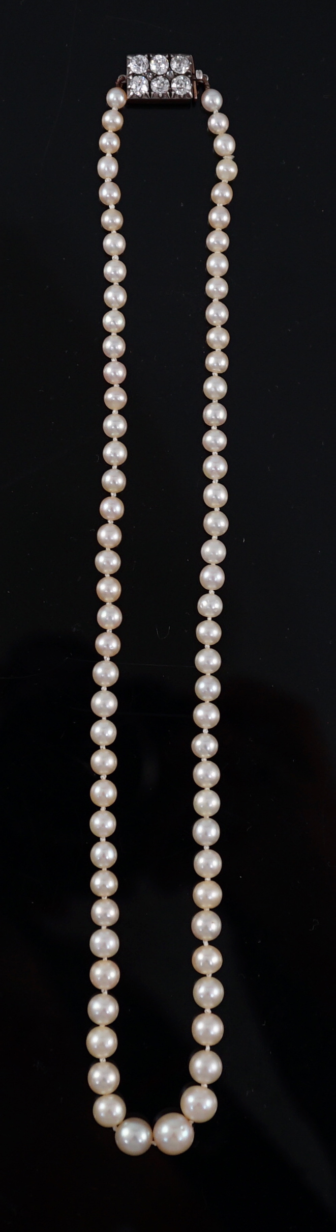 A late Victorian single strand graduated natural saltwater pearl necklace, with six stone old round cut diamond set silver and gold rectangular clasp